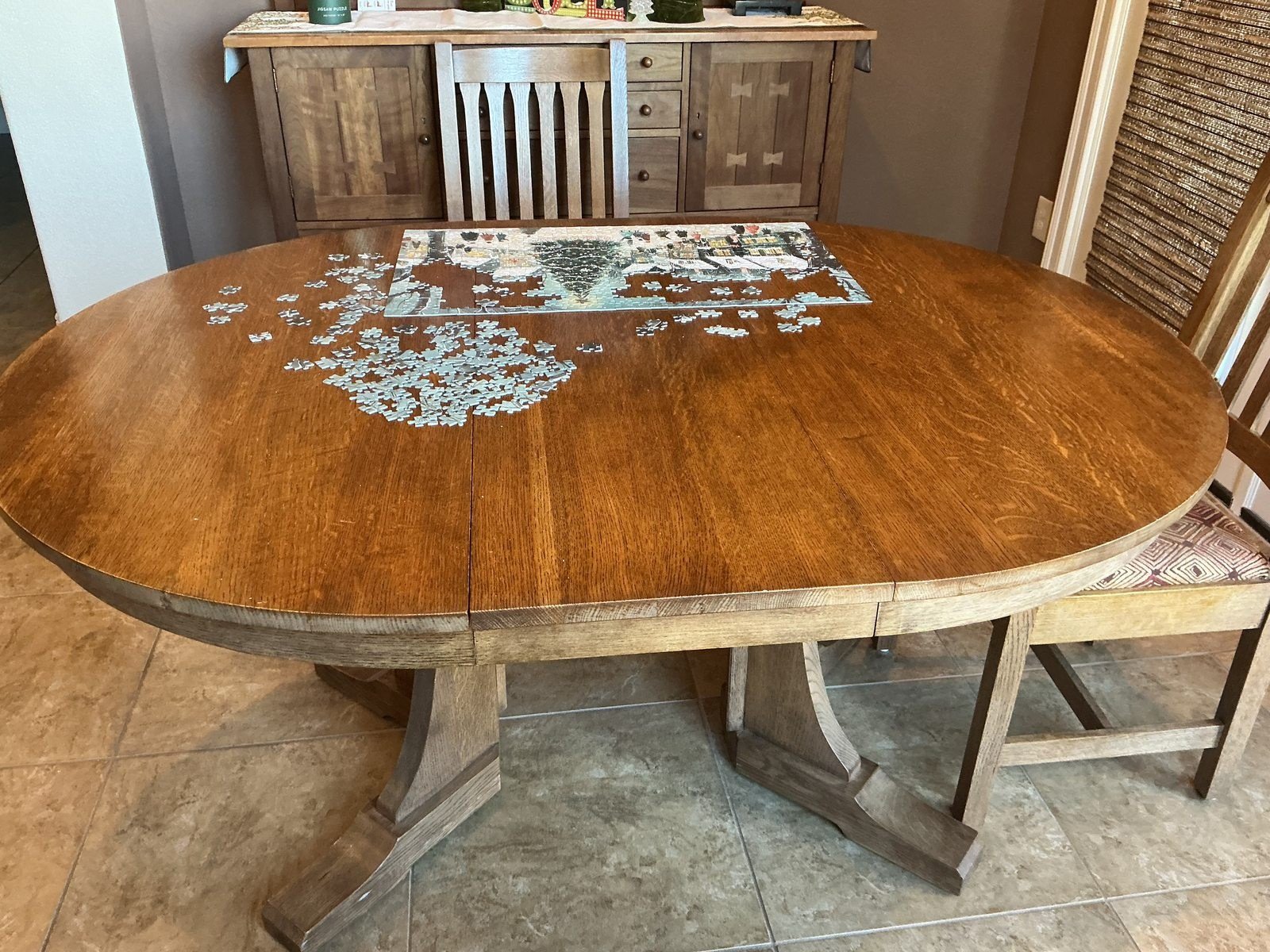Oak dining table before refinishing in Rogers, Arkansas