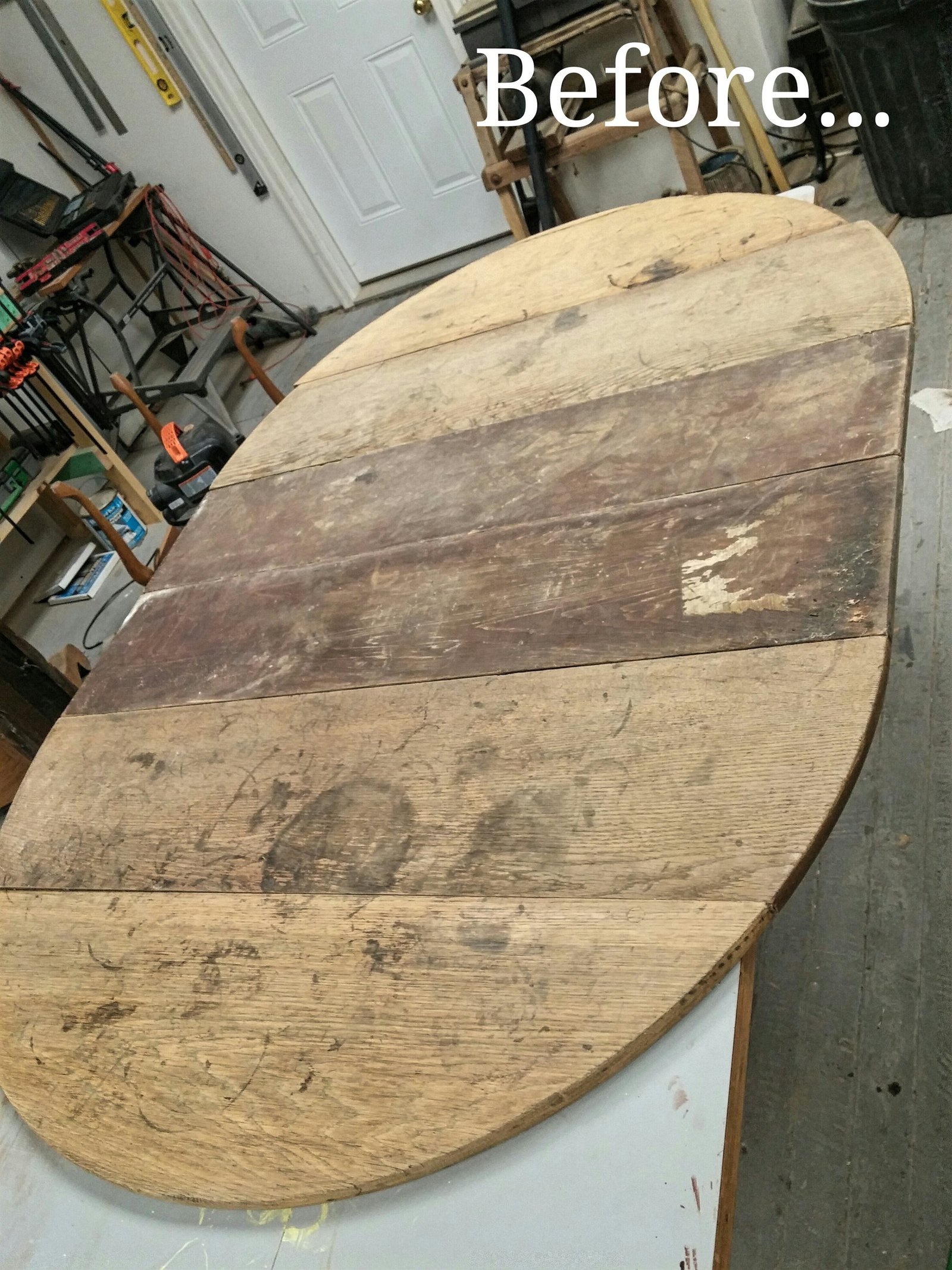 Weathered round plank tabletop before refinishing