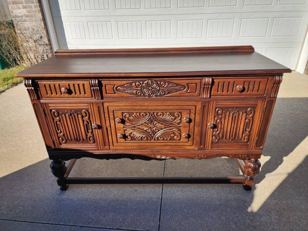 ornate carved buffet after restoration