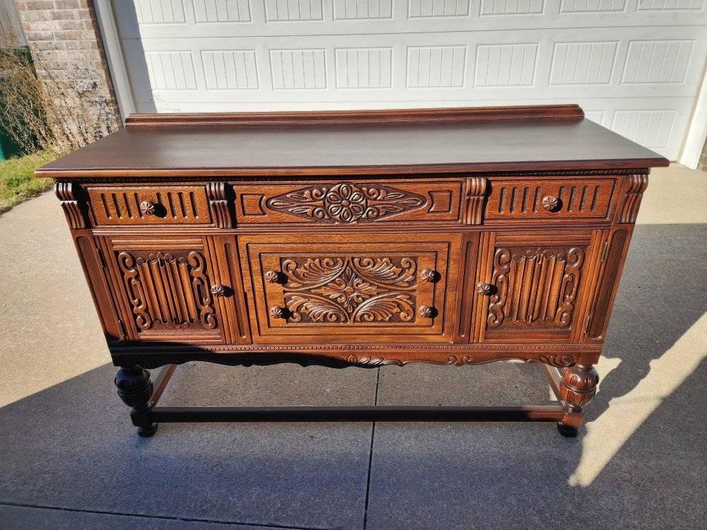 Ornate carved buffet after restoration