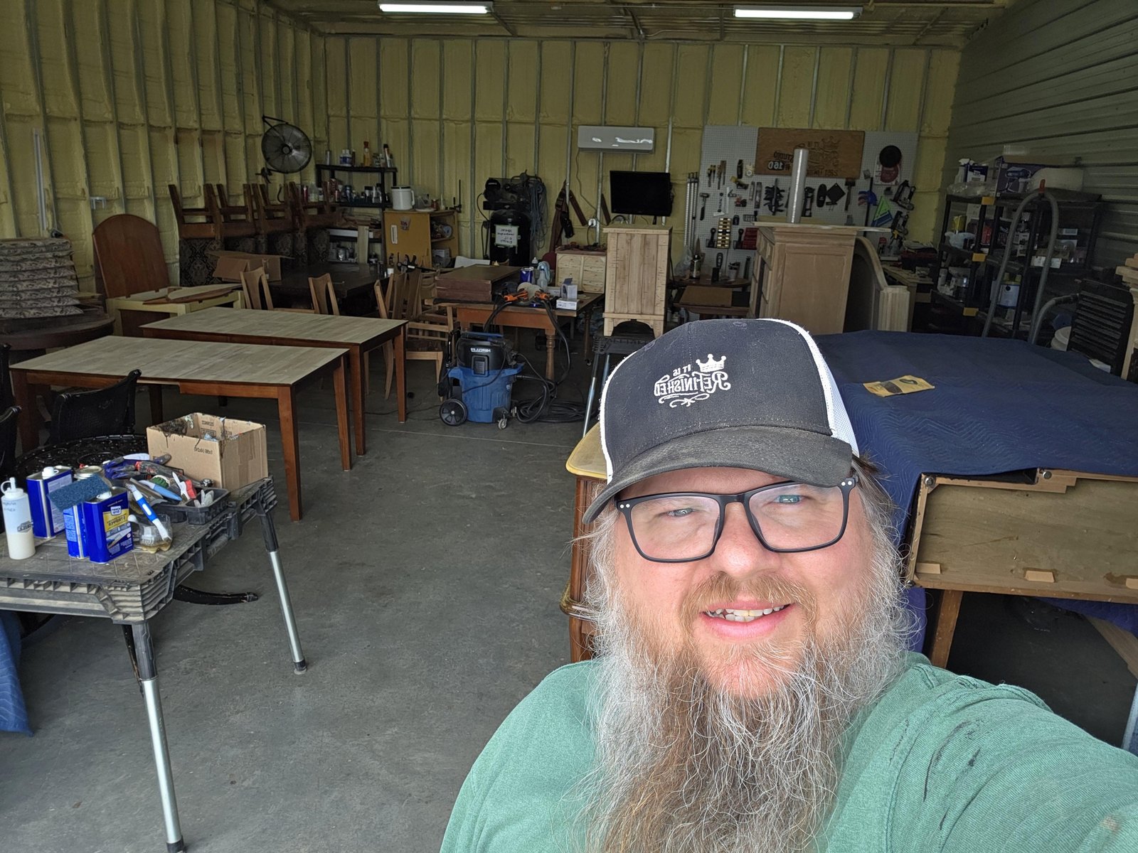 Jacy Shelton, owner of It Is ReFinished, in his furniture refinishing shop in Rogers, Arkansas