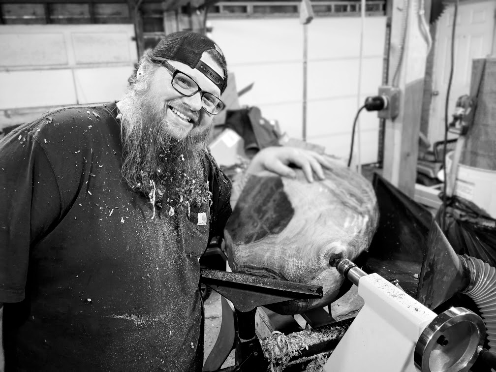 Jacy Shelton working in the It Is ReFinished shop in Northwest Arkansas.