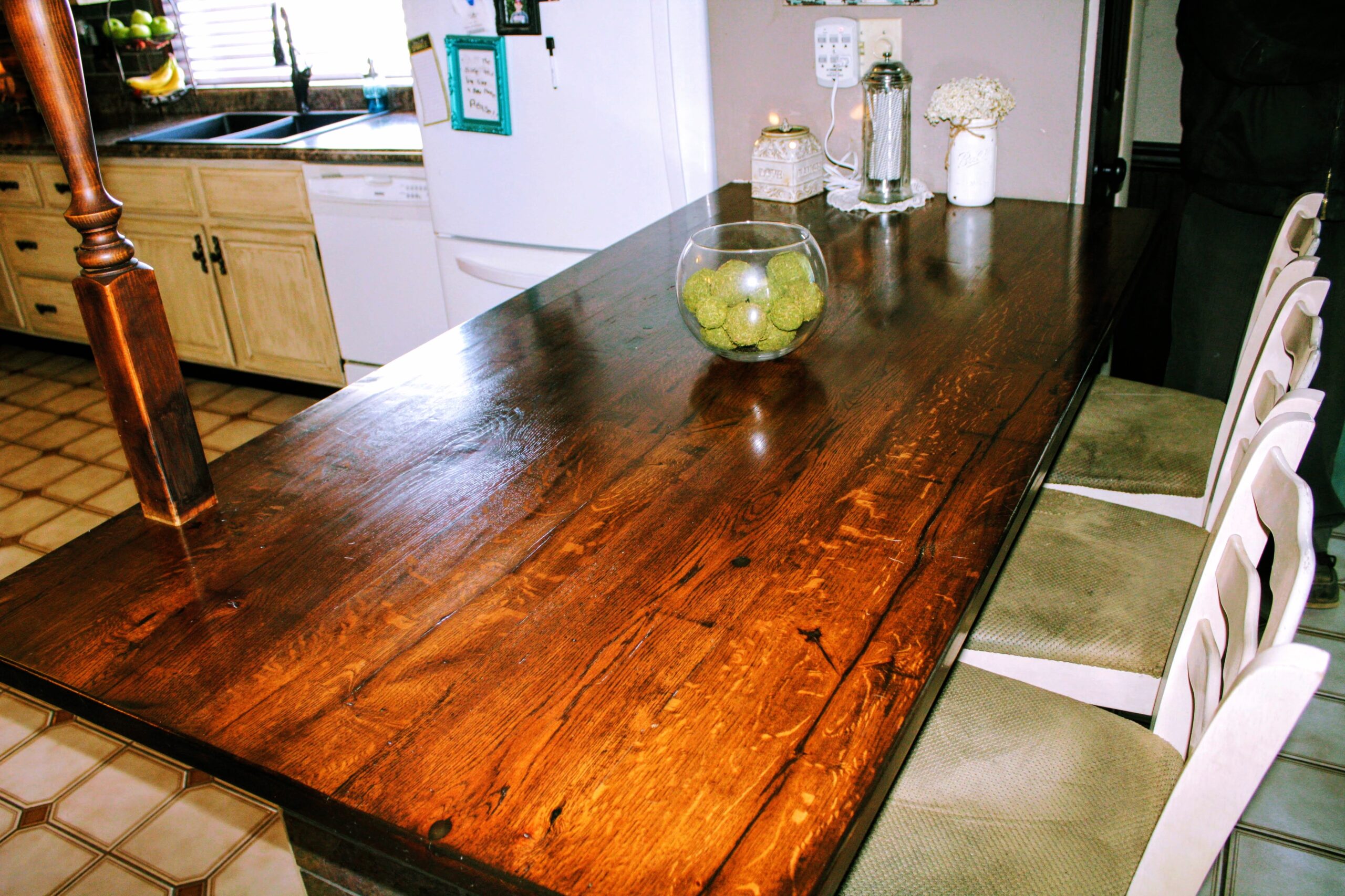 Refinished quarter-sawn oak kitchen island with rich warm stain.