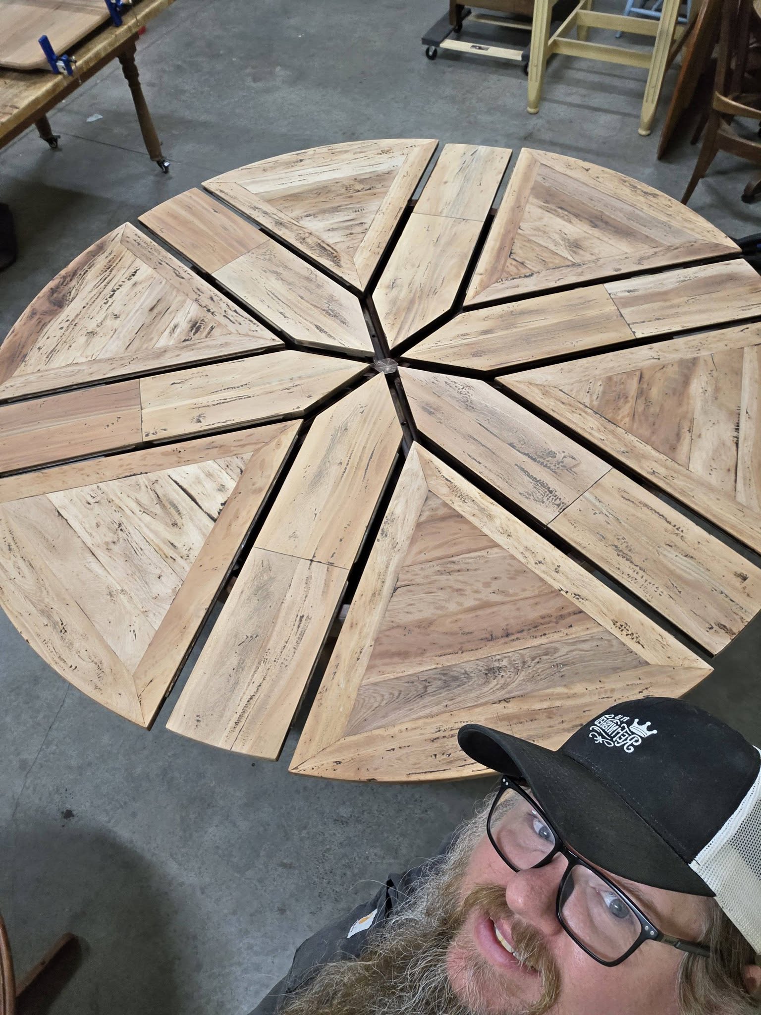Segmented round wood table top being restored.