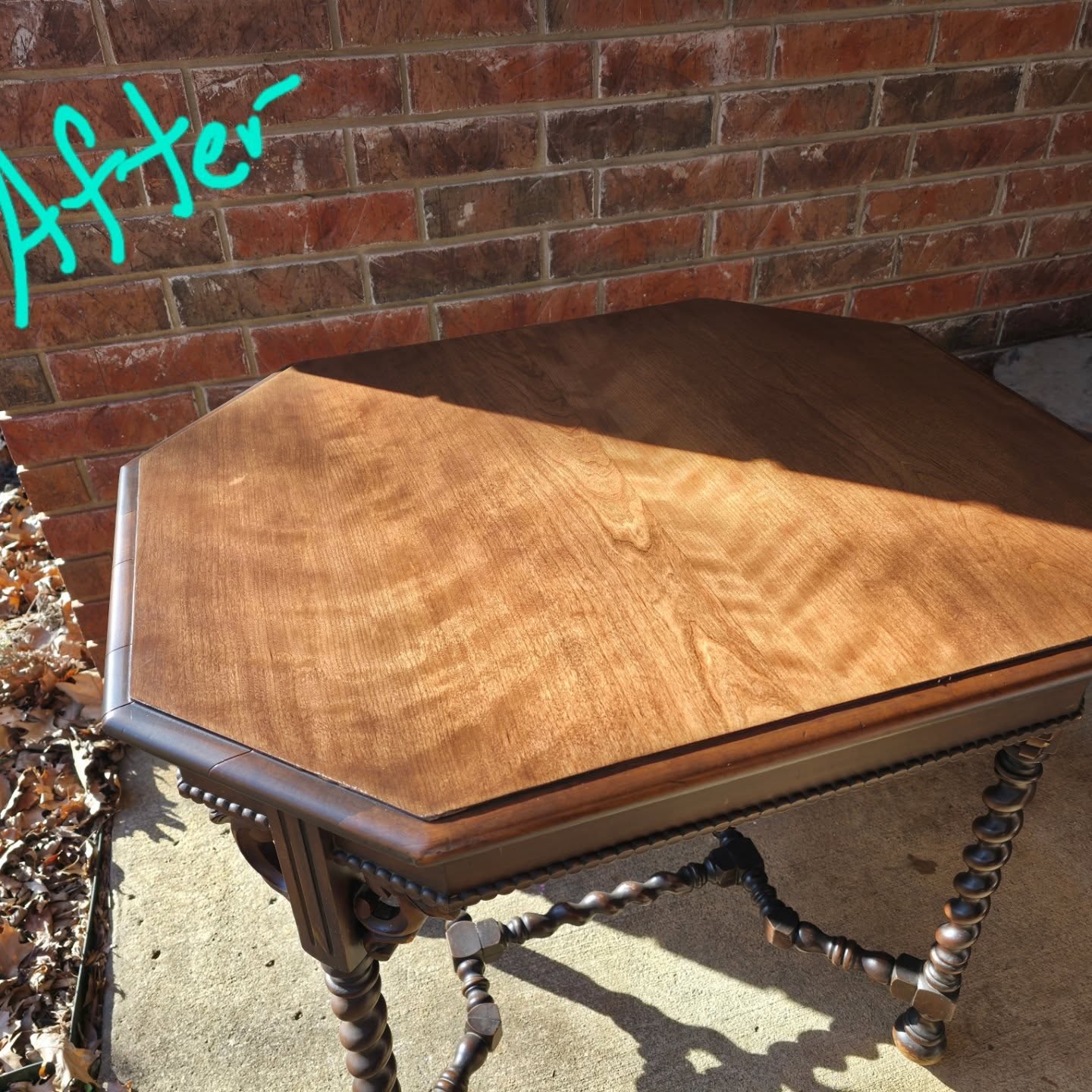 Octagonal antique wooden table refinished to reveal beautiful natural wood grain.