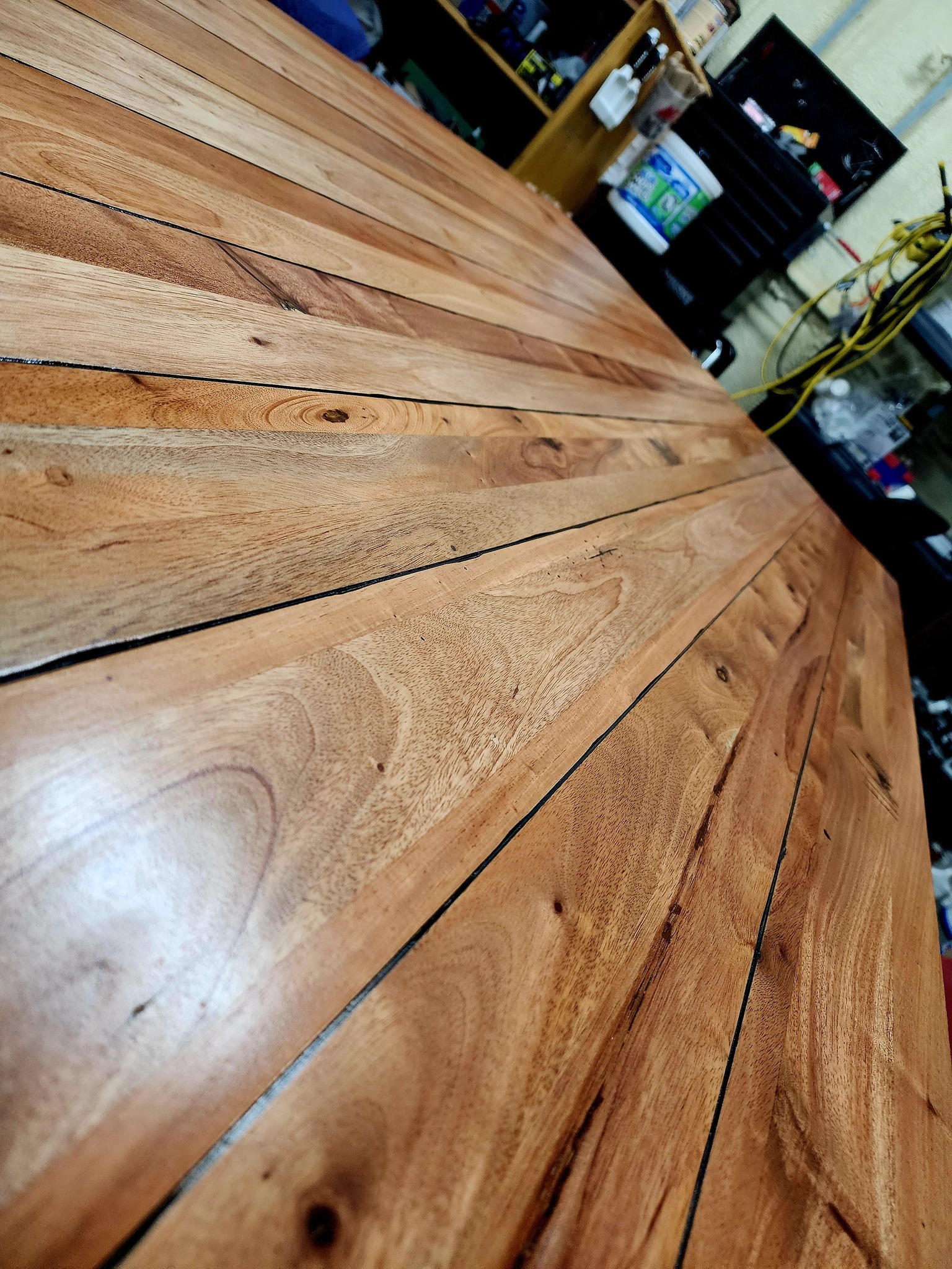 Close-up perspective of wood tabletop grain pattern.